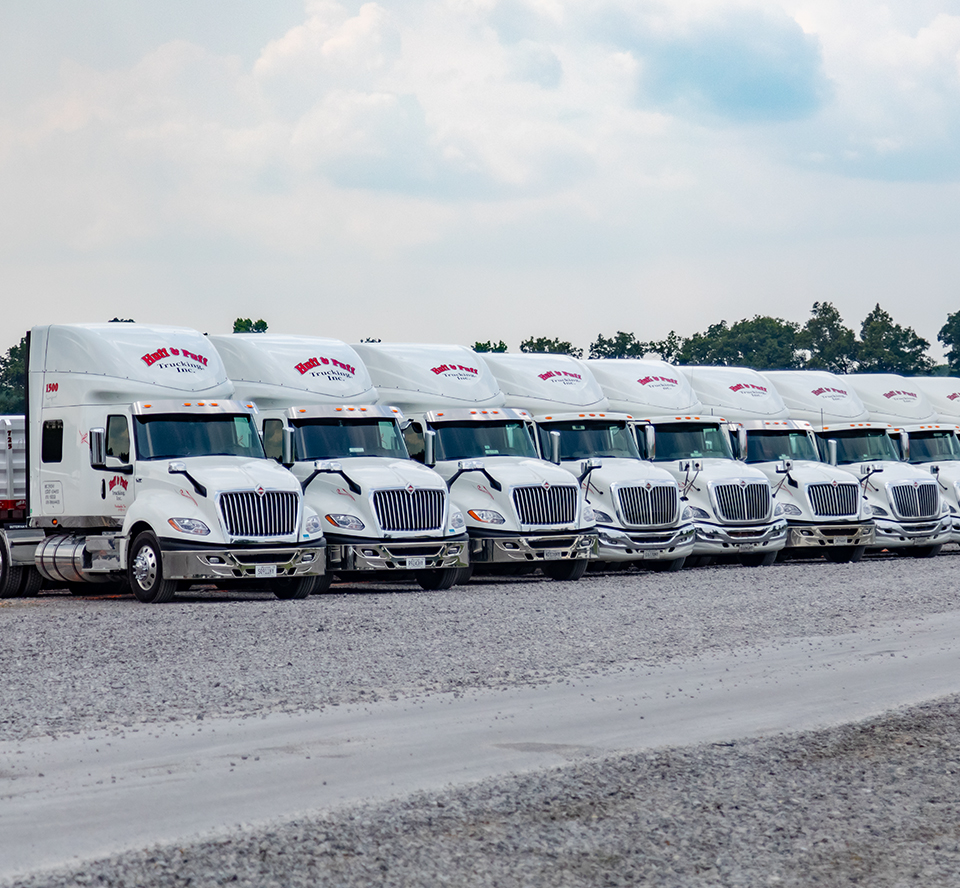 Huff and Puff Semi Trailer Trucks parked in a line