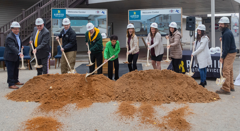 Group of people participating in a groundbreaking