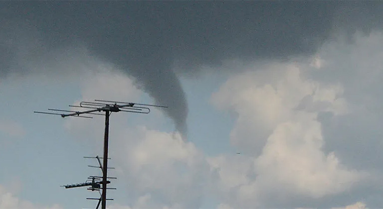 Tornadoes forming in sky