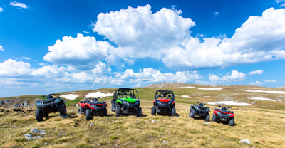 Line of ATVs and UTVs in a valley