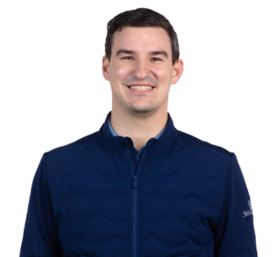White male with dark hair and dark blue jacket.