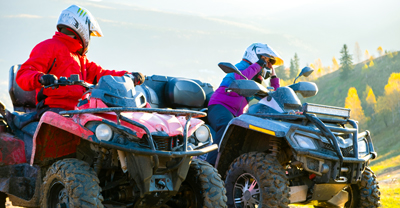 Two people on ATVs