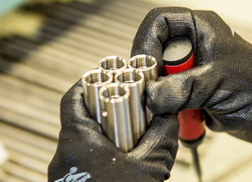 Close up of manufacturing workers hands.