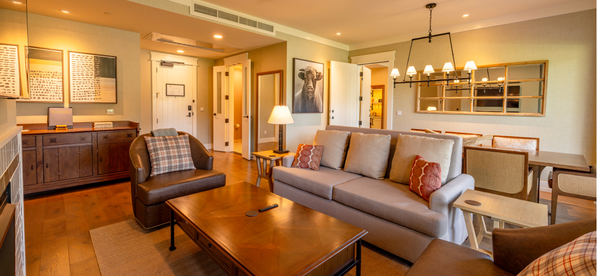 Parlor living room area with room entrance and connecting bedroom access. 