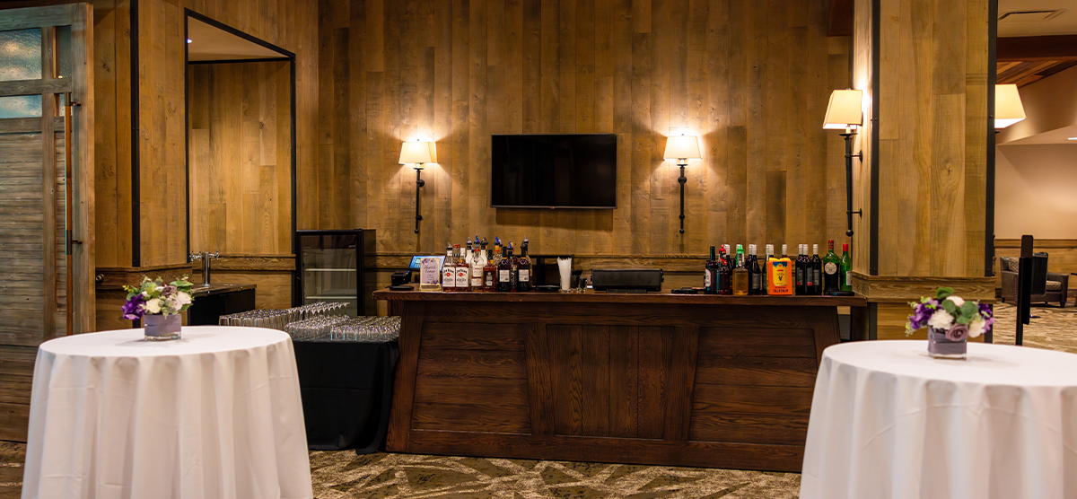 carousel-wedding-venue-grand-hall-3-1200x556 Grand hall bar area with round tall tables.