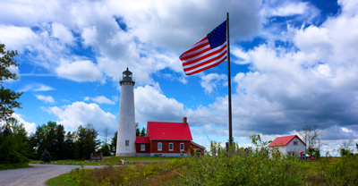 Lighthouse and American flag.