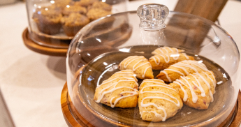 Scones under a glass lid. 
