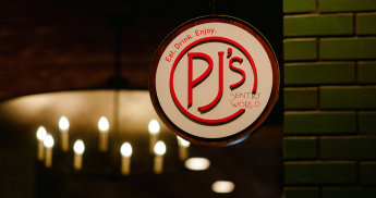 PJ's restaurant circular logo sign.