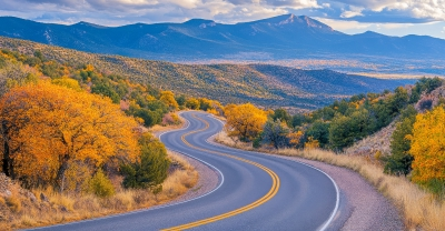 Road through mountain landscape in Fall