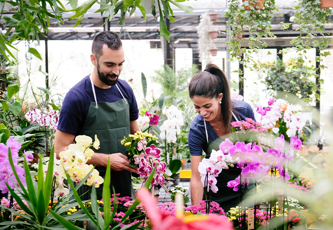 Two people working in a flower shop