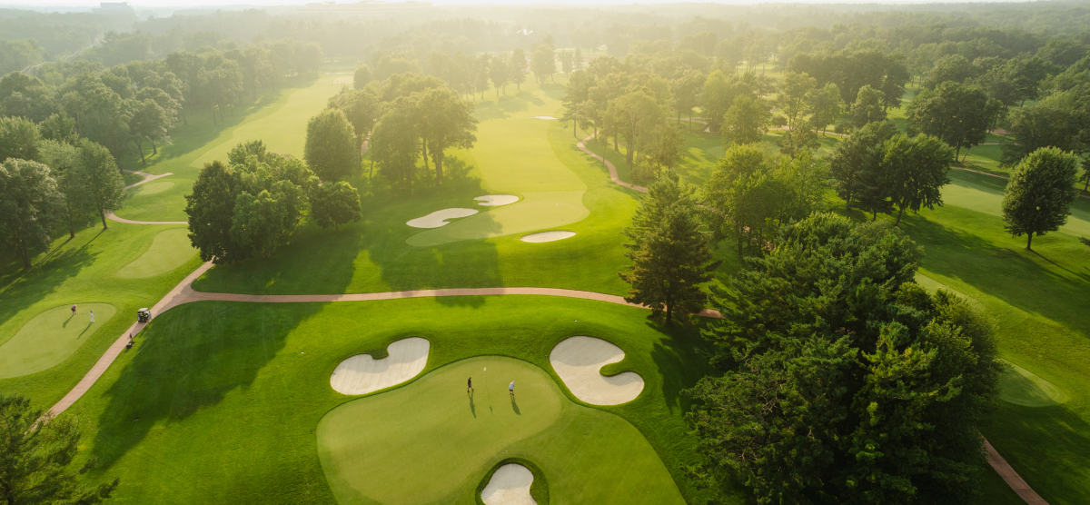 Aerial view of golfers golfing at SentryWorld.