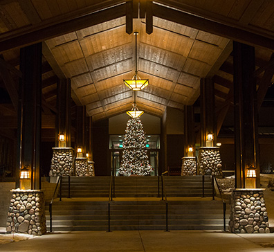 SentryWorld entrance at night with holiday decorations.