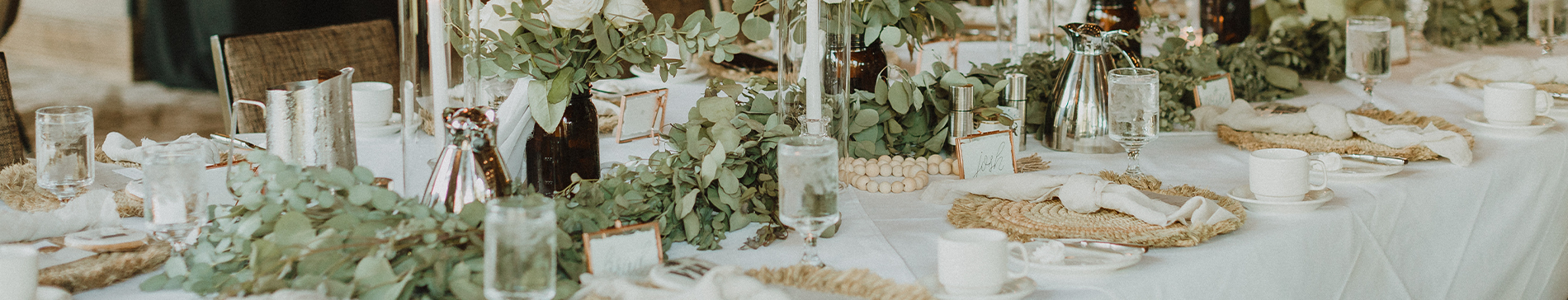 Greenery and table decor for a wedding reception in the Grand Hall