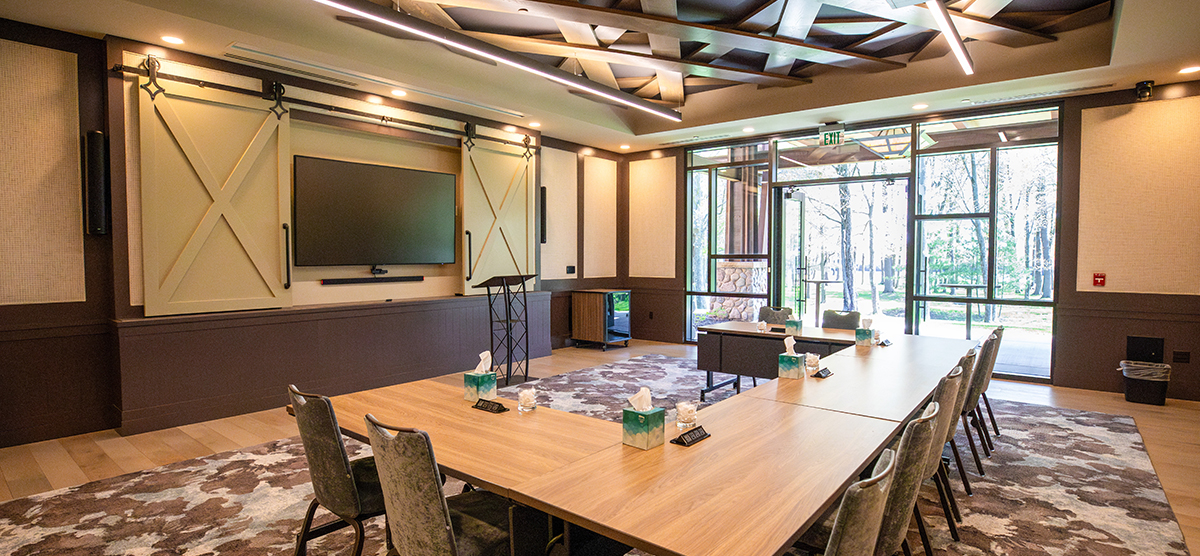 The Inn gathering room set up with a U shaped table for a meeting.