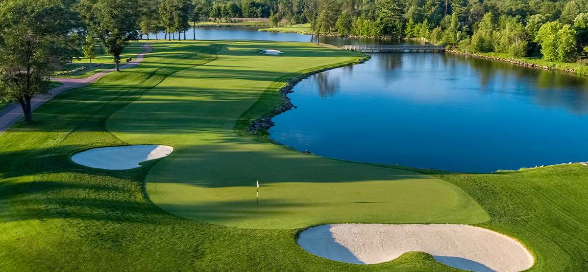 Thirteenth hole putting green and water hazard at SentryWorld