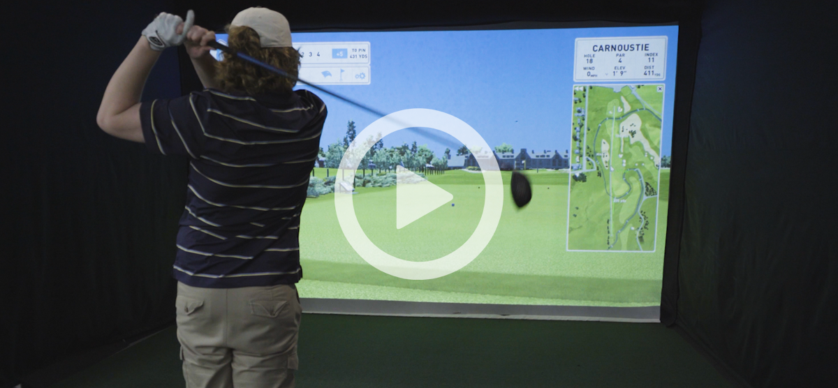 Still shot from a video of a golfer using the golf simulator at SentryWorld