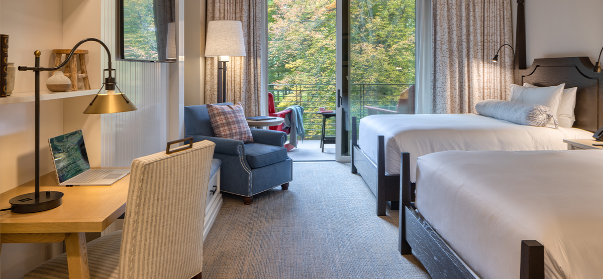 Two queen bedroom with patio door facing hole 18. 