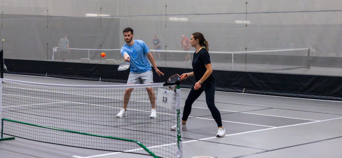 carousel-fall-league-signup-pickleball-4-1200x556 Players play pickleball at the SentryWorld fieldhouse.