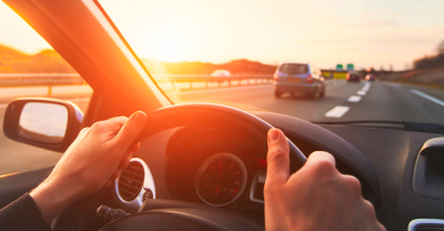 Person driving car on highway