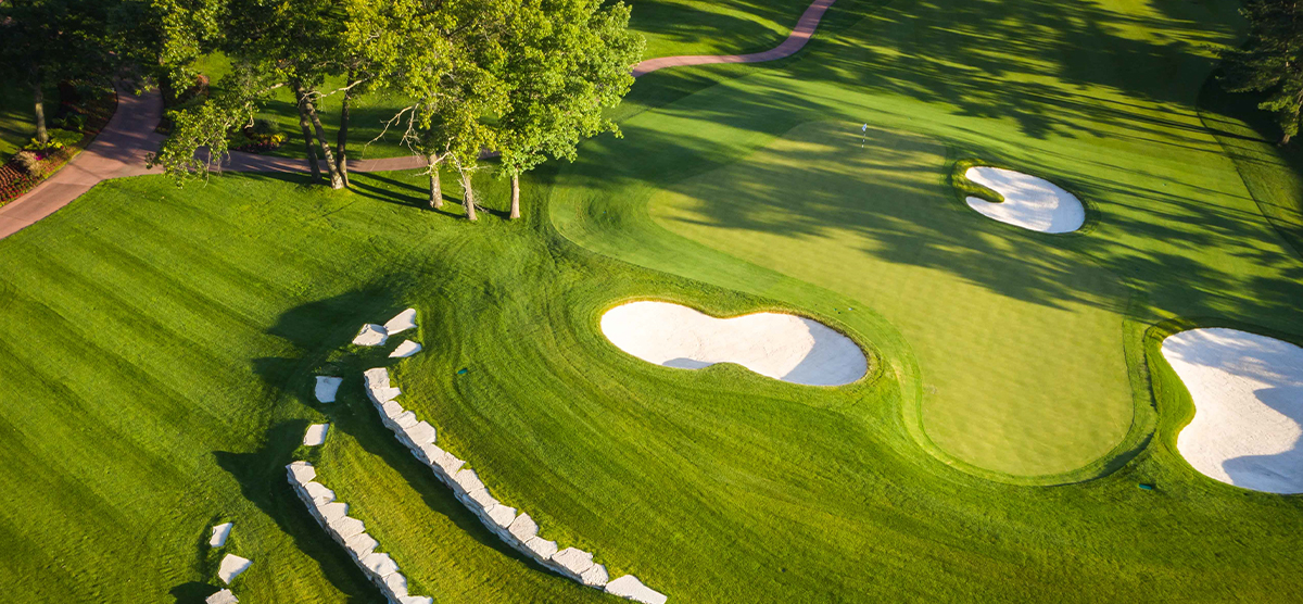 Aerial view of the eighteenth hole putting green and sand traps at SentryWorld