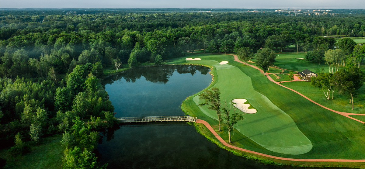 Aerial view of the thirteenth hole fairway and water hazard at SentryWorld