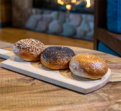 Three bagels on a board at The Inn at SentryWorld