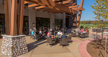 People dining on the outdoor patio at PJ's - SentryWorld