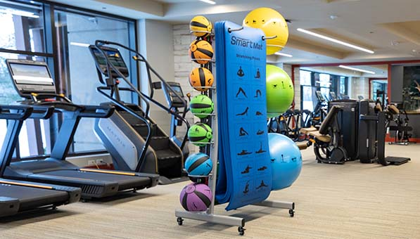 Cardio machines and workout mats in the Fitness Center