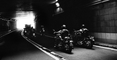 Group of motorcyclists in tunnel