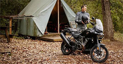 Man at a campsite with his motorcycle