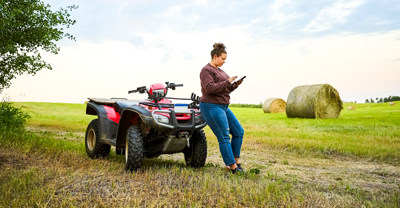 Woman on phone by ATV