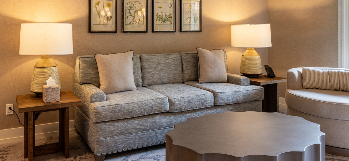 Seating area with couch, chair, and end table. 