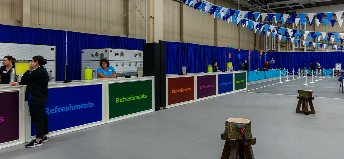 Event booths set for a corporate event in the fieldhouse at SentryWorld