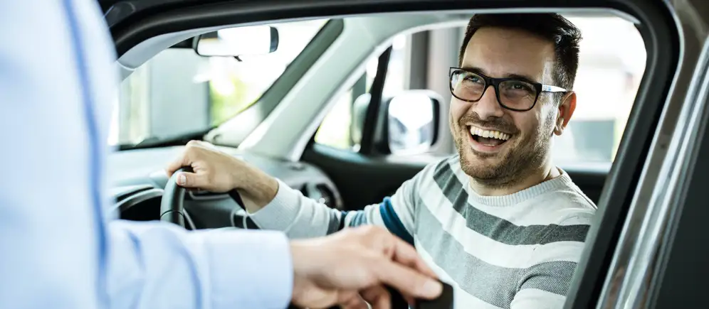 man-in-drivers-seat-smiling-LG man in drivers seat smiling