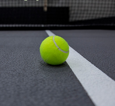 Tennis ball on a tennis court in the fieldhouse at SentryWorld