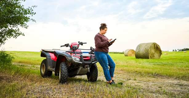 Woman on phone by ATV