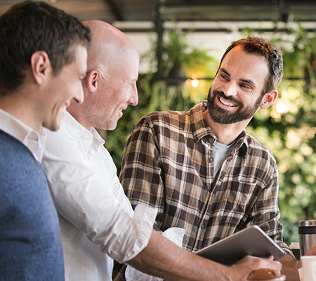 Three men having a conversation