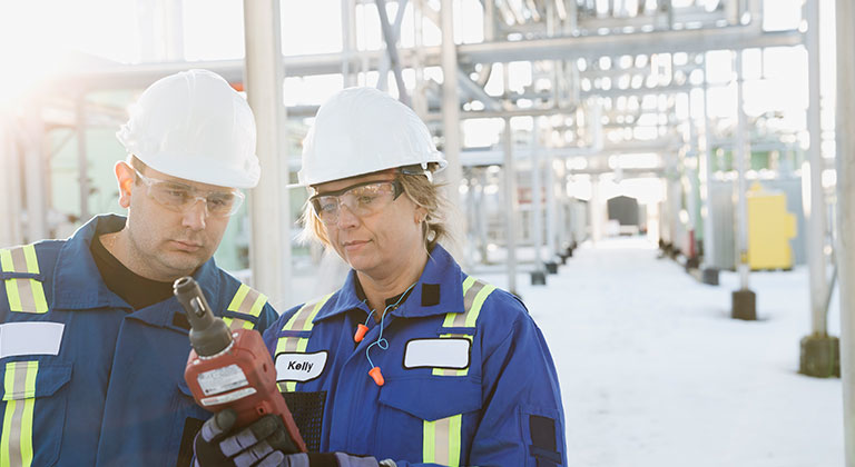 Man and woman checking carbon monoxide levels