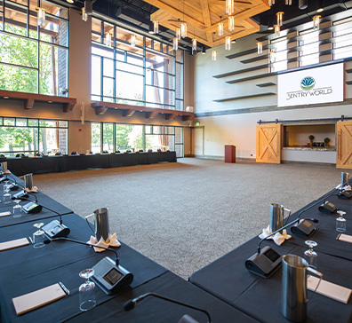 Tables set for a corporate meeting in the Atrium at SentryWorld