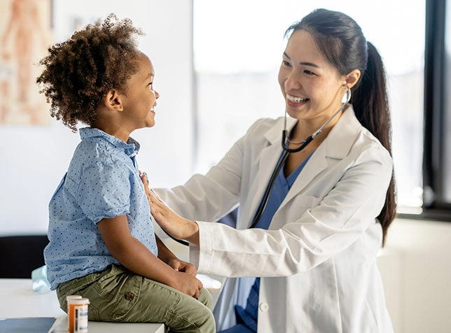 a doctor caring for a child