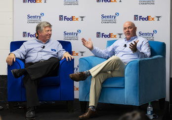 Sentry representatives sitting in blue chairs