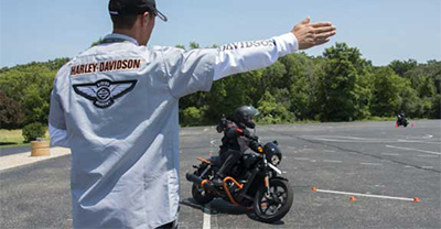 Man giving directions to a motorcycle rider