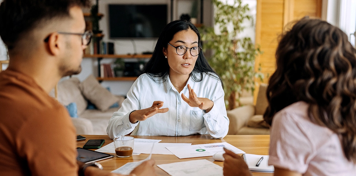 insurance-specialist-talking-to-man-and-women-LG Insurance specialist talking to a man and a women
