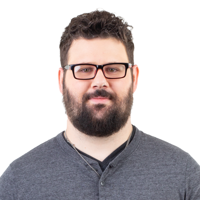 Man with dark hair, beard, and glasses