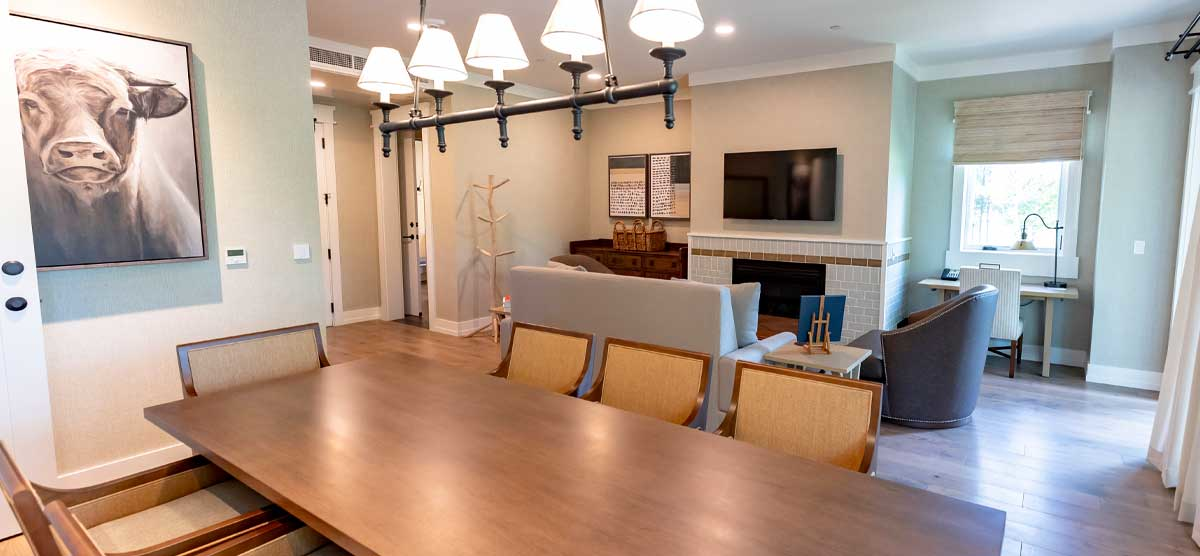 Dining table and lounge area in the Queen Suite in The Inn at SentryWorld