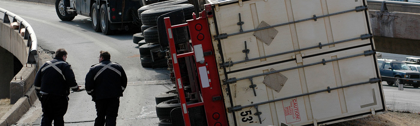 Semi trailer truck turned on side from accident