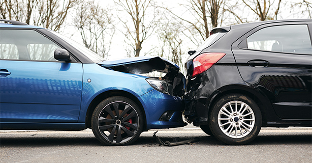 Two damaged vehicles following a collision