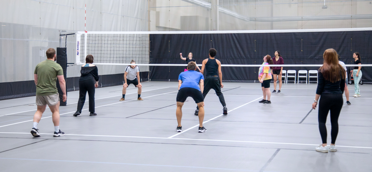 carousel-fall-league-signup-volleyball-1-1200x556 Players play volleyball at the SentryWorld fieldhouse.