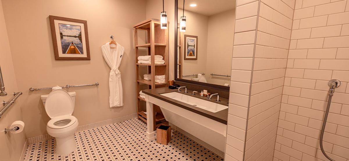 carousel-accessible-king-terrace-2-1200x556 Accessible bathroom with sink wheelchair space.