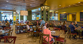 PJs dining room with tables of people enjoying dinner. 